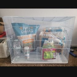 Chinchilla Or Rabbit Cage, Food, Hay, Large Water Container, And 2 Big Bags Of Bedding. Also Sand So Chinchilla Can Bathe