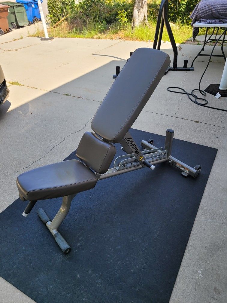 Life Fitness Adjustable Weight Bench for $250 Firm (WALNUT 91789)