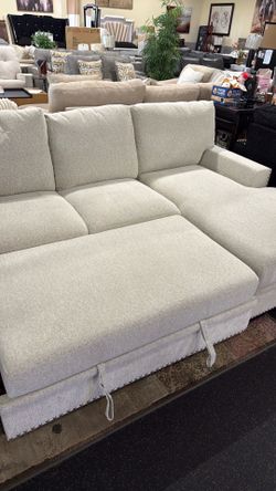2 Piece Sectional with pull out bed & storage chaise on sale