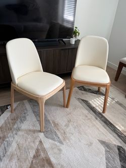 Pair of Modern  Faux leather cream colored dining or office chairs