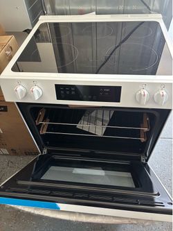 New Frigidaire - 5.3 Cu. Ft. Freestanding Electric Range with Steam-cleaning and EvenTemp - White Model: FCFE3062AW
