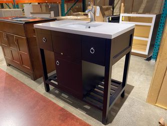 Black Bathroom Vanity with White Top and Chrome Faucet