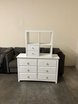 White shelving unit and dresser