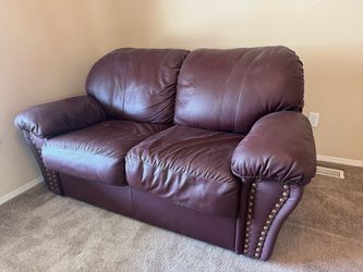 Leather loveseat, maroon color