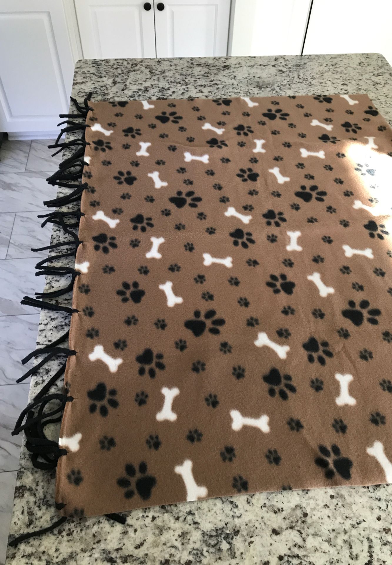 Handcrafted fleece blanket 3’x5’ Dog bones and paw prints