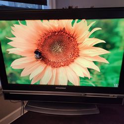 Sylvania 30" Flatscreen Hd Tv Complete With The Stand And Remote