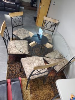 Elegant glass dining set rod iron w/5 cushioned chairs