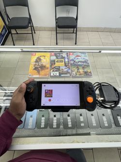 Nintendo Switch | With  grip controller | 4 Games |200GB SSD