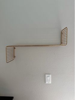 Gold wire wall shelf