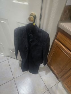 Dark grey or black pinstripe two-piece suit
