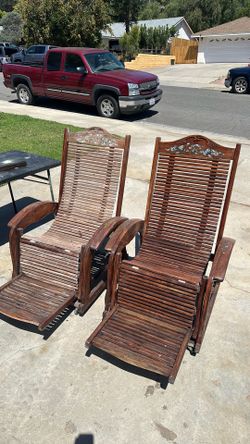 Two free teak, reclining chairs