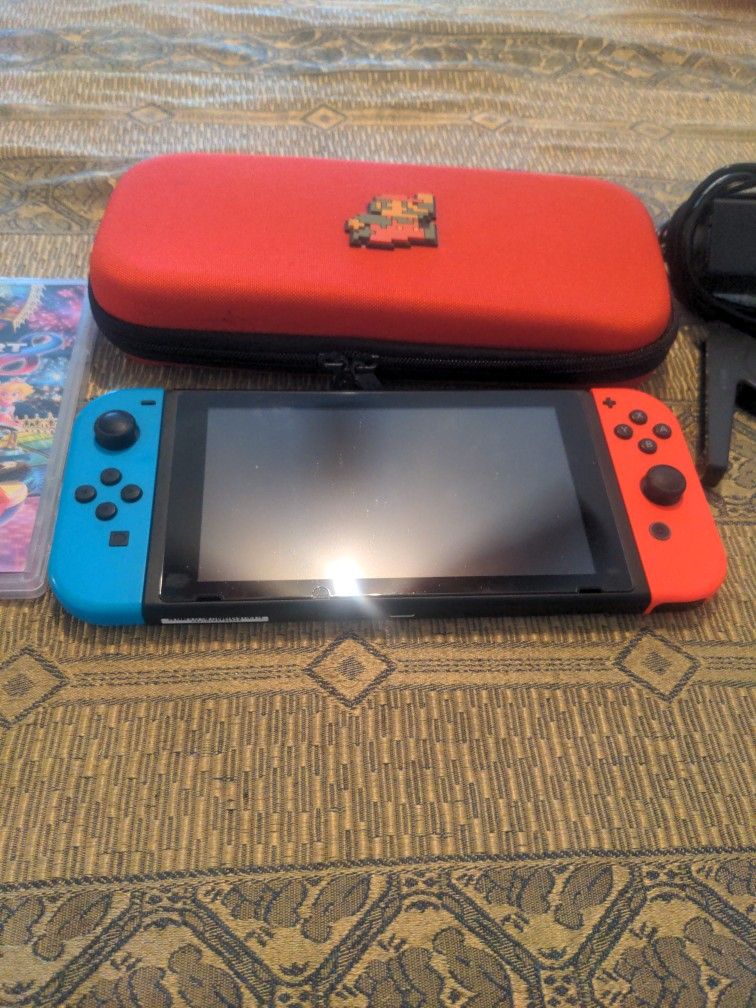 Nintendo Switch Used Plus One Game The Case The Charger And The Joystick All Used Excellent Working Condition.