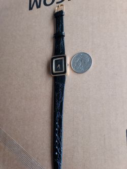 Beautiful Rectangular woman's watch working.