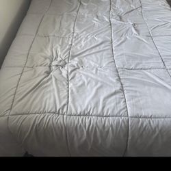 queen sized mattress + black bed frame