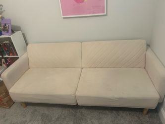 Cream Couch/Futon, 6ft long, 2ft5in tall and wide