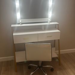 Vanity table With Light And Chair.   Sturdy And Great Condition.  5’10” H X 4 Ft W X 2’ D