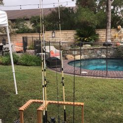 FIVE (5) Fishing Rods Wirh Spinning Reels Plus an OAK Fishing Rod Holder