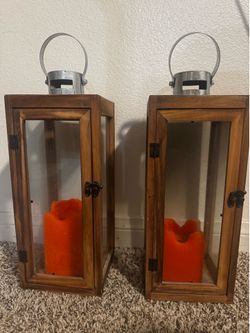 2 wooden and glass candle holders