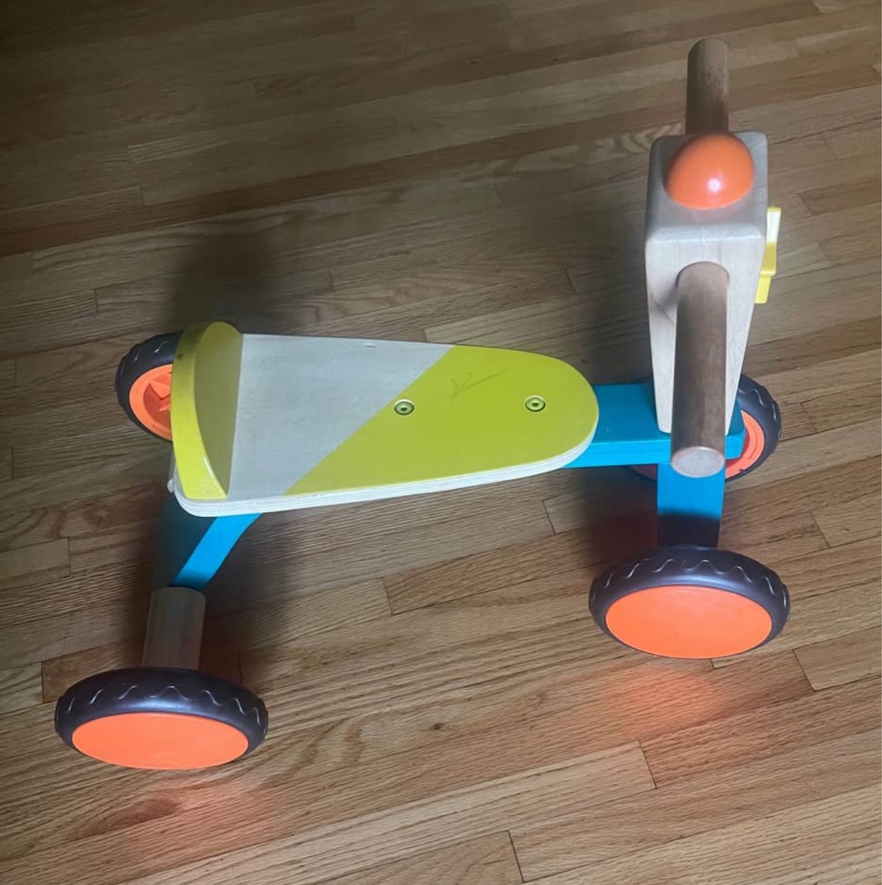 Wooden toddler ride-on toy with 4 wheels