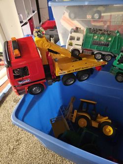 Box of garbage trucks and  backhoe