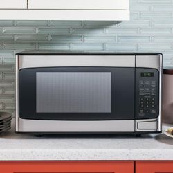 New in box GE 1.1 Cu. Ft. Capacity Countertop Microwave Oven (Stainless Steel)