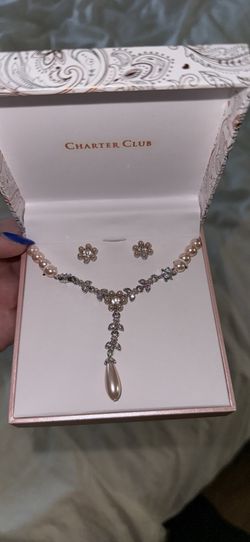 Matching pearl earrings and necklace