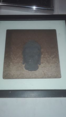 Antique budah head. in shadow box