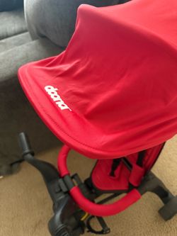 Red doona bike stroller