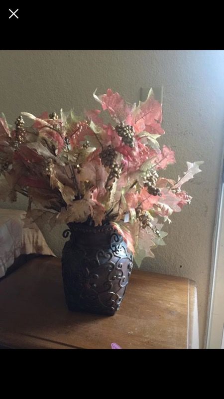 Flower vase and lot of fall leaves