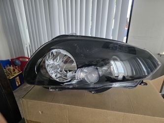 Hella brand headlight for a Volkswagen Golf,  MK6 model (e.g., 2011 VW Golf GTI)