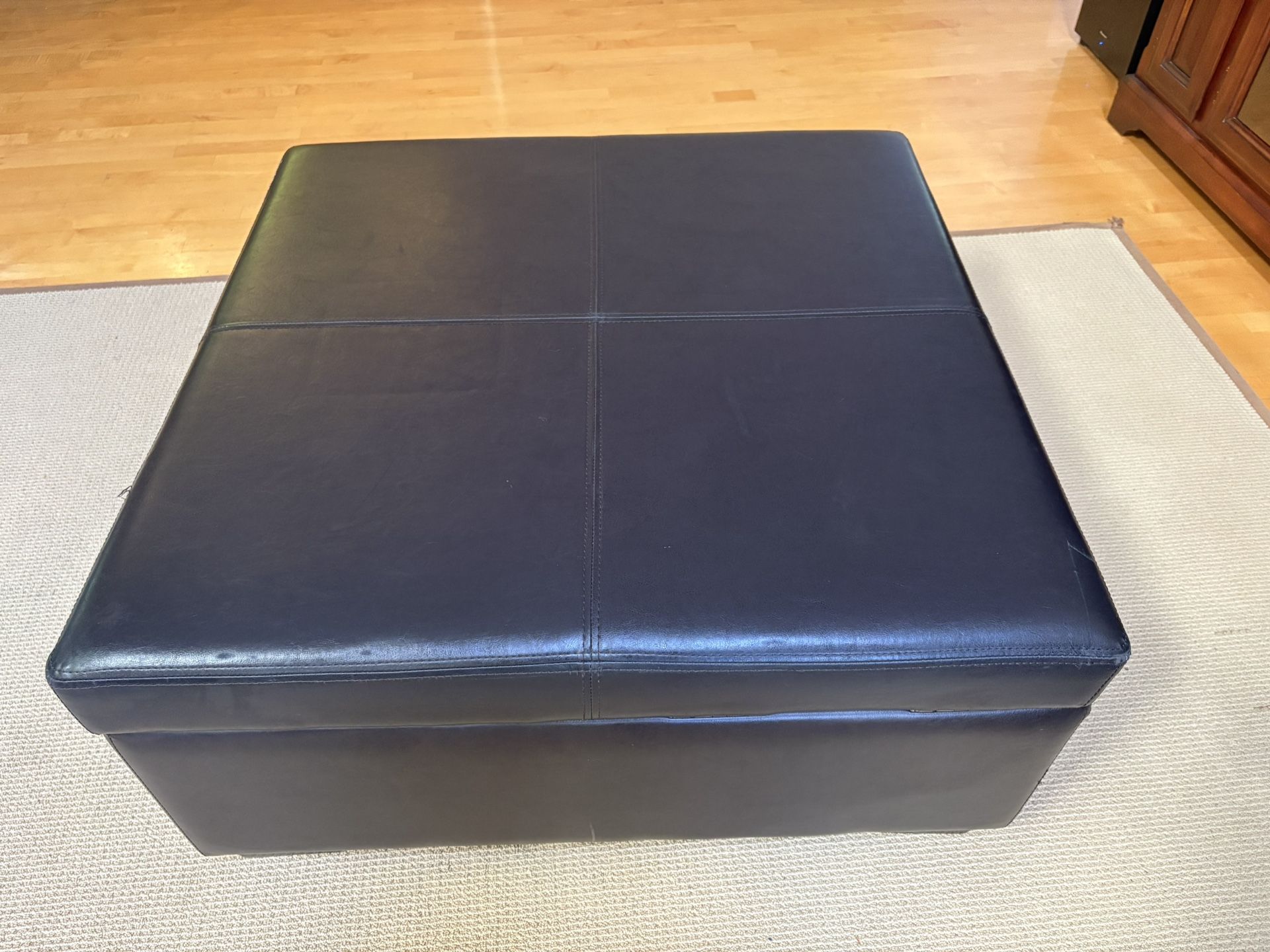 Black Faux Leather Hinged Padded Ottoman