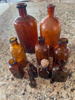 10 very old chemist’s bottles