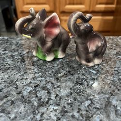 Vintage Japan Ceramic Elephants Salt & Pepper Shakers.   Size approximately 3 inches tall.  Preowned with cork stoppers.  Japan is stamped on the bott