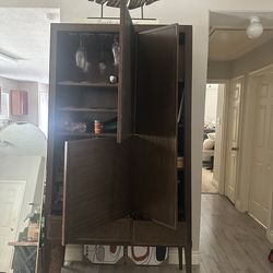 Dark brown wood armoire