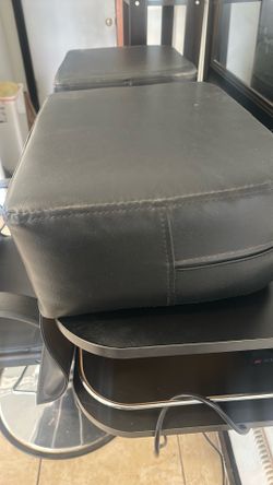 Black booster seat for salon chair