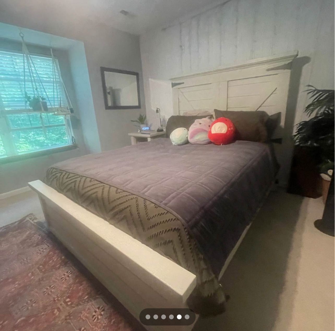 Queen sized cream color farmhouse style bed and nightstand