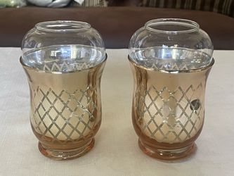 Vintage amber glass candle holders with lattice patterns and clear chimneys.