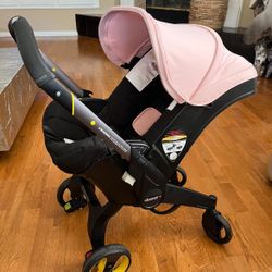 Doona Car Seat, Stroller And Base(Baby Pink) $400