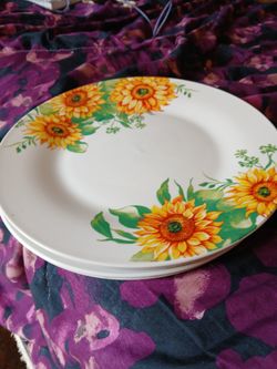 Four Sunflower Plates  2.00 Each Firm