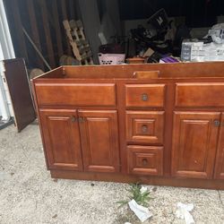 bathroom cabinet with countertops and sink 