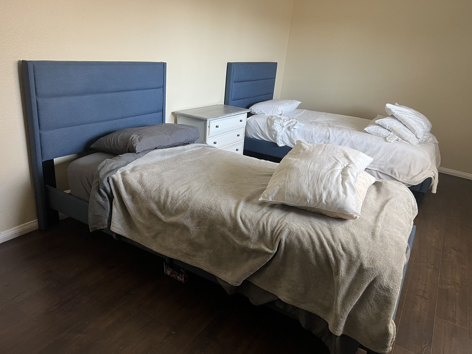 2 Twin Beds With Bedding And Night Stand