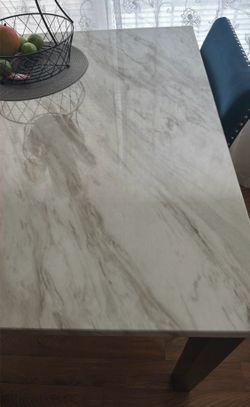dinner table with four chairs