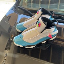 Turquoise and white men’s size 12 air Jordans