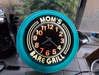 Mom's bar and grill clock illuminated