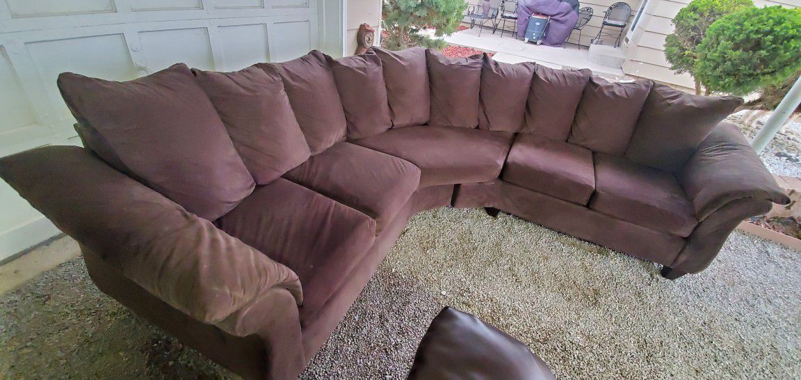 Dark brown Two-piece Couch Sectional. Delivery Available.Has Some Repairs Here N There But Sits Well