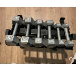 In NEW Condition Set Of Cast Iron Hex Dumbbells 5s, 10s, 15s 20s  And  25s  (NO RACK iNCLUDED)
