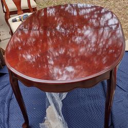 Dark Cherry Wood Table With Extra Leaf And Four Chairs One Chair Is Captain's Chair