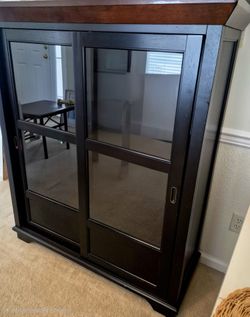 Black Wood Cabinet with Sliding Glass Doors
