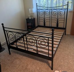 Black metal bed frame, new mattress and box spring