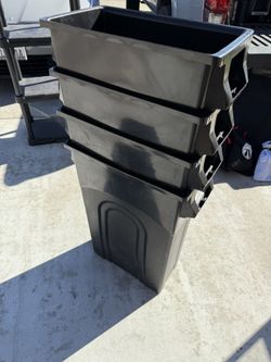 4 Big Trash Cans And 1 Small 